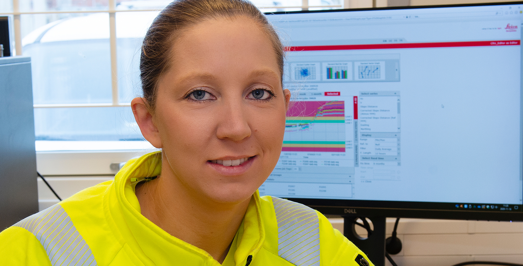 Eva Nilsson with computer monitor showing GeoMoS monitoring software from Leica Geosystems AG