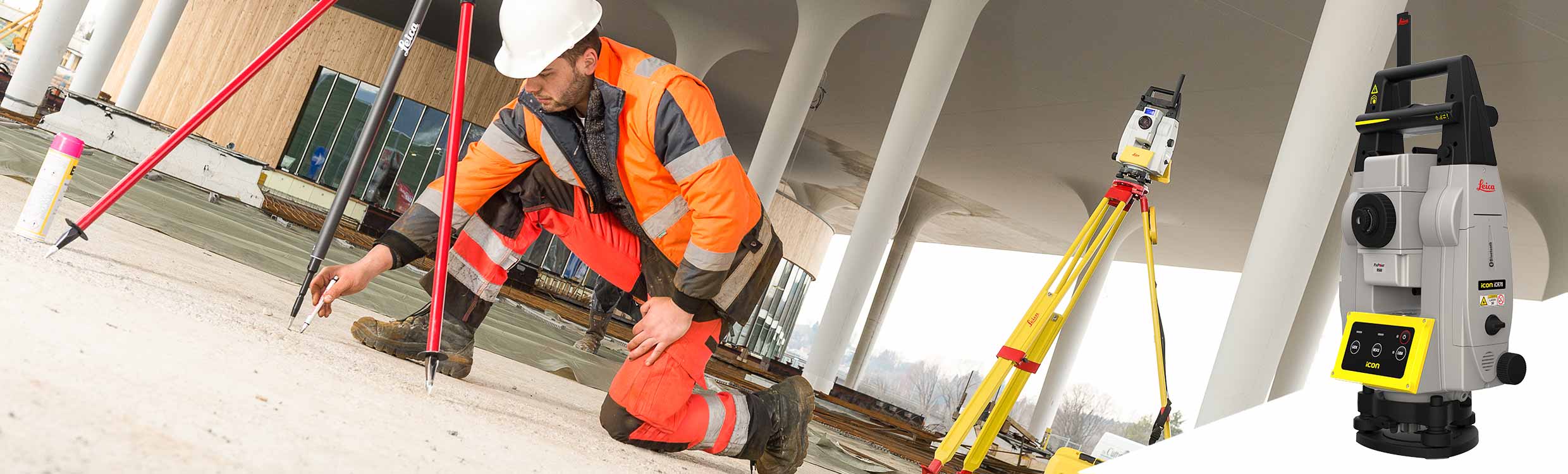 Construction worker is marking points on the floor of a building construction project with a Leica iCON iCR70 construction robotic total station during layout.