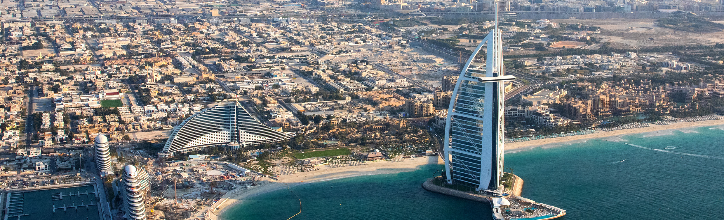 Aerial view of Dubai's coastline including the 7-star high rise hotel, Burj Al Arab