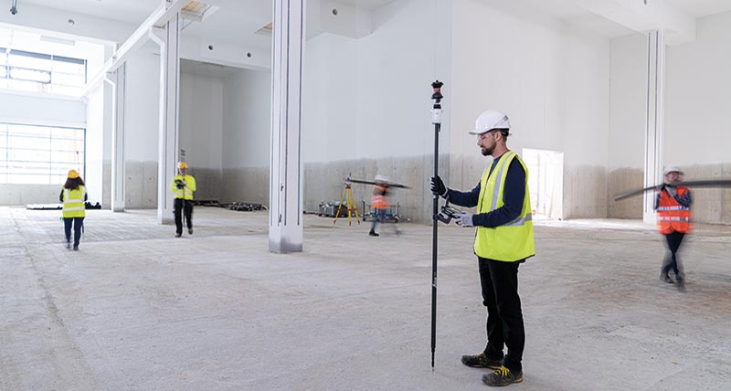 Multi-surveyor crew on a construction site using the AP20 prism pole with target tracking and locking to maintain prism lock.						